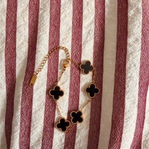 Elegant Gold and Black Clover Bracelet